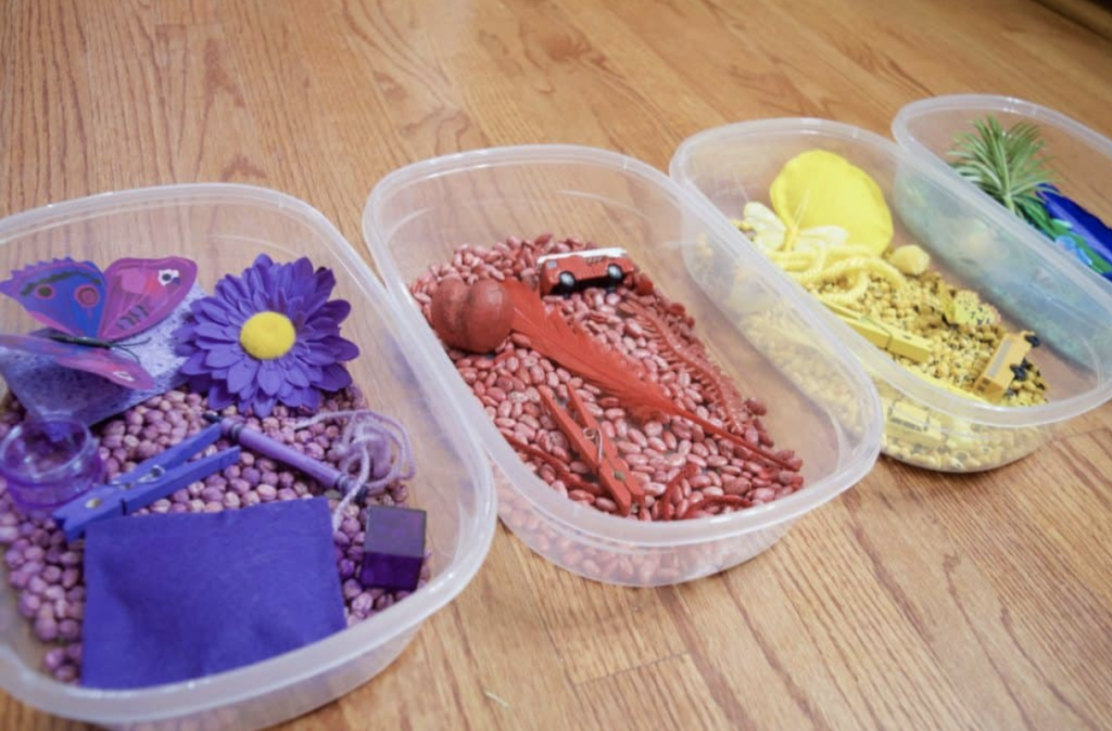 colorful sensory bins in a row