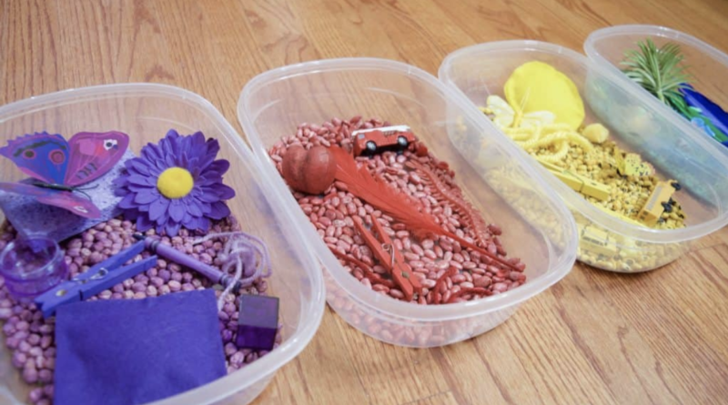 colorful sensory bins in a row